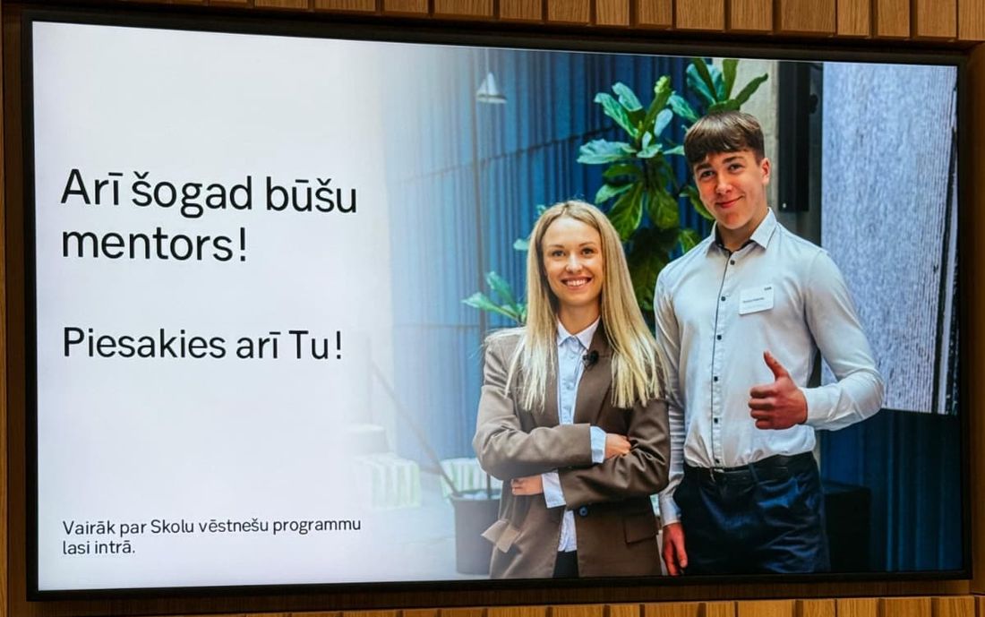 SEB office screen inviting students to apply, showing Kristers as a mentor